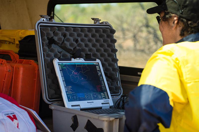 Operating a remotely piloted fixed wing drone involves monitoring flight data on a laptop that can withstand field conditions. Credit - eriss
