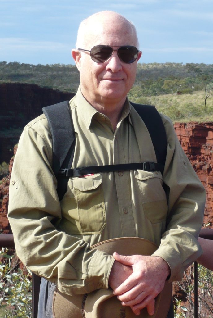 Photo of Ken Wallace, hills in the background