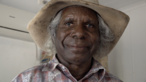 A close-up portrait of senior Gooniyandi man, Mervyn Street. 