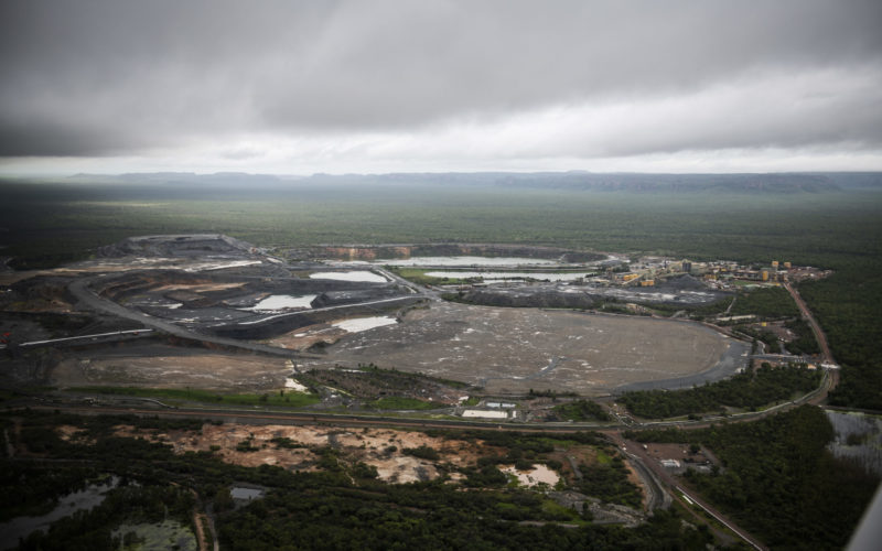 Ranger uranium mine aerial photo with grey wet season skies above and dense, dark green vegetation surrounding the mine.