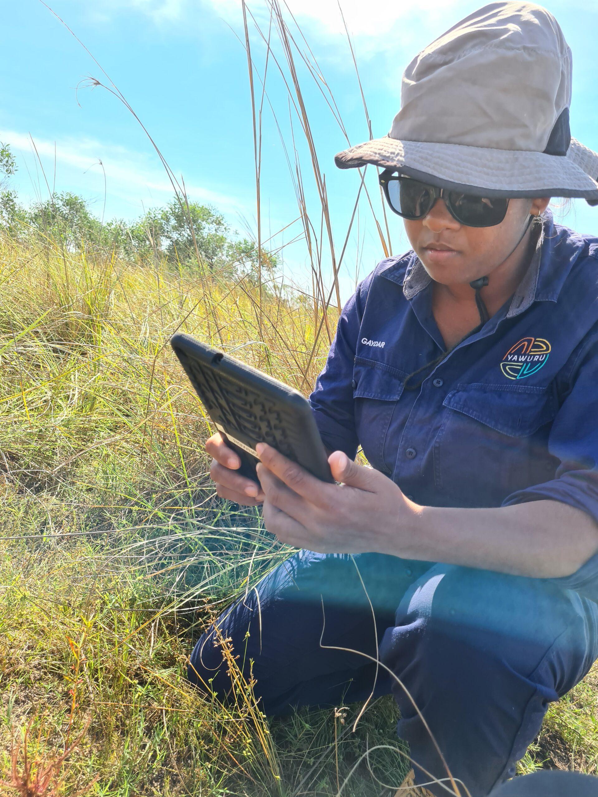 Yawuru Country Manager recording changes on the FULCRUM app. Photo: Rebecca Dobbs.
