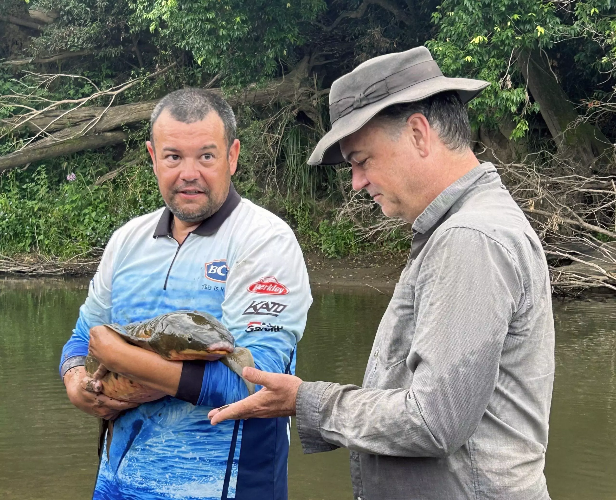 Tom Espinoza and Mark Kennard with an Australian lungfish - a threatened species found only in south-east Queensland. Photo: Cait Mill.