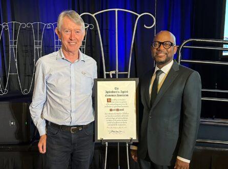 Pictured: Professor David Pannell (left) and Dr Norbert Wilson (right), president of the AAEA. Photo courtesy of the AAEA. 
