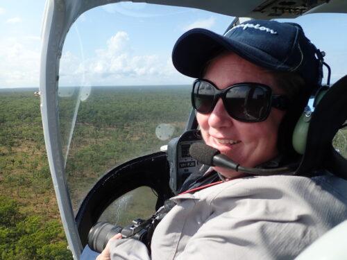 Dr Natalie Rossiter-Rachor conducts helicopter testing of a mobile application in Litchfield National Park. The app enables aerial mapping of gamba grass and other weeds at a landscape scale. Photo: NESP Resilient Landscapes Hub.