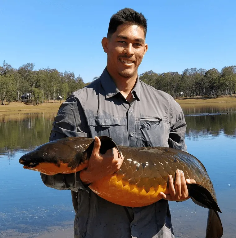 Australian Rivers Institute PhD Candidate Colin Burke with an Australian lungfish.